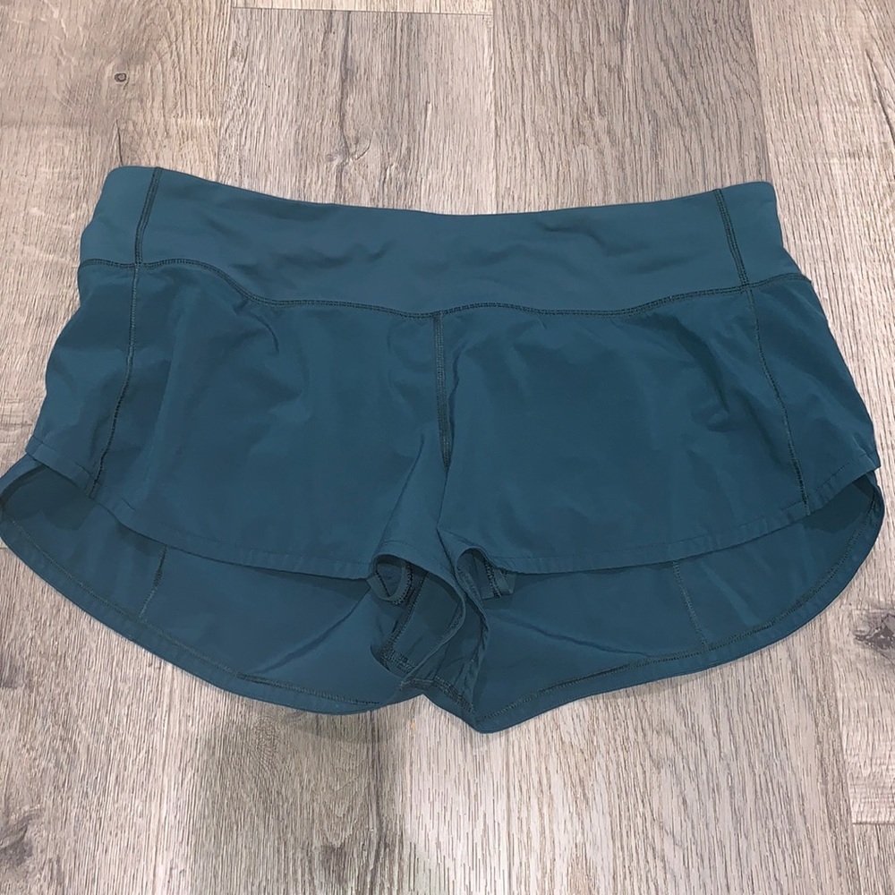 Dark turquoise/ teal shorts 2.5 inseam.